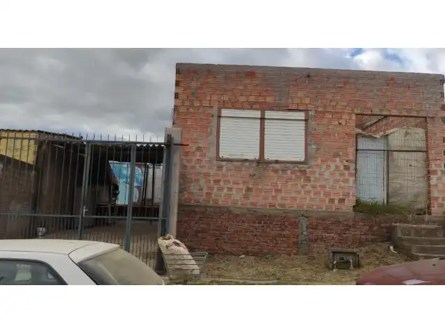 UMA CASA NA RUA MÁRIO LOUGUÉRCIO PAIVA, N° 1121 EM BAGÉ/RS